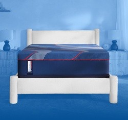 Head on view of Posturepedic Elite hybrid mattress with a blue gradient background - mobile